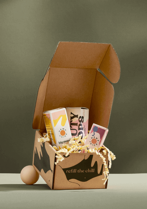 open cardboard box with cbd oils inside