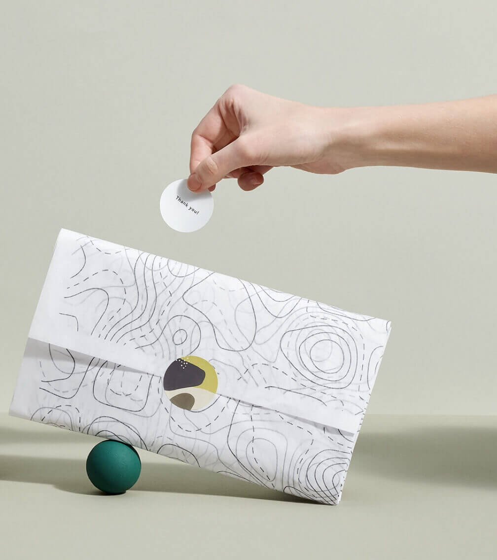 item wrapped in white tissue paper